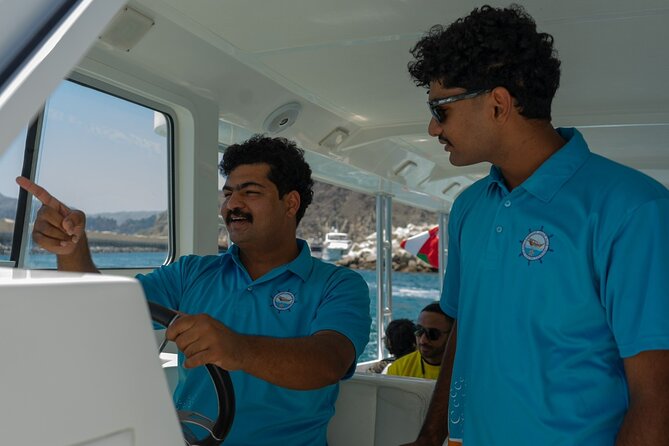 Dolphin Watching and Snorkeling Cruise Experience in Muscat - Watching dolphins in open water