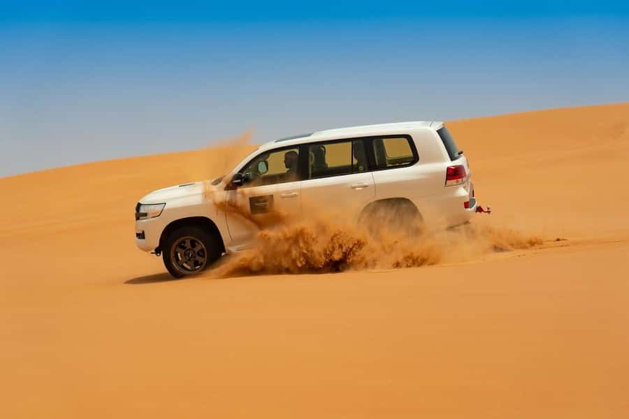 Dubai: Desert Safari with BBQ Dinner - Sandboarding and the sunset photo stop