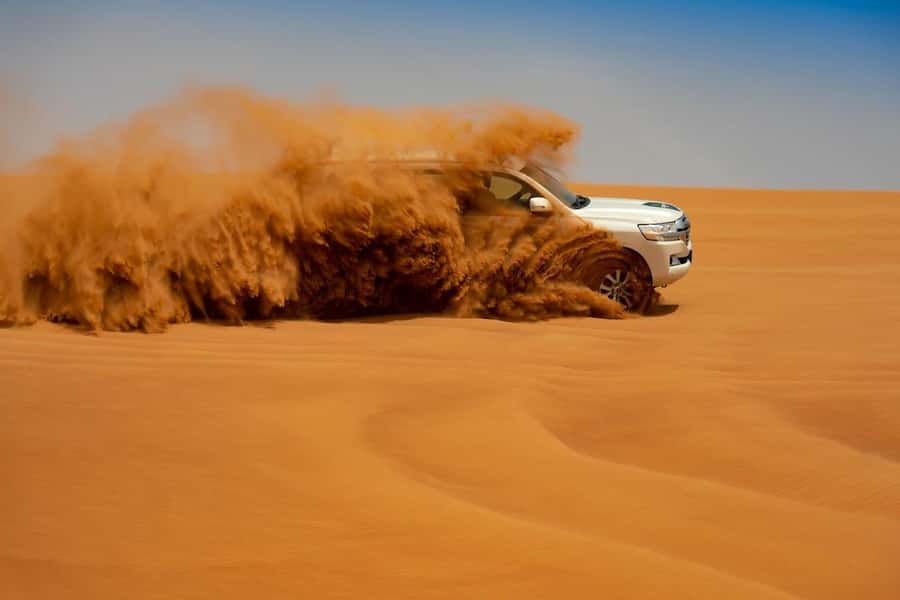 Dubai: Desert Safari with BBQ Dinner - Dune bashing with a confident 4x4 driver