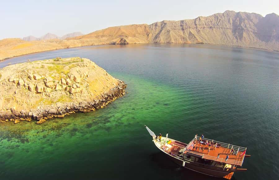 From Khasab: Fjords of Musandam Dhow Cruise & Buffet Lunch - Watching for dolphins near Khasab