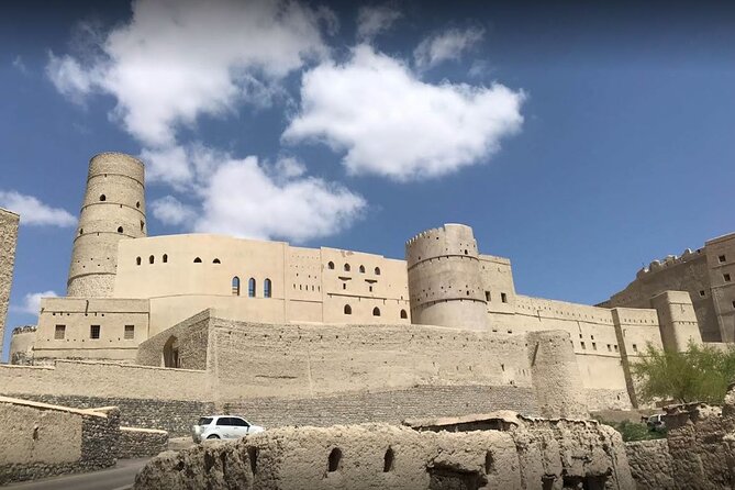 Full-Day Nizwa Fort, Bahla Fort and Jabreen Castle Private Tour - Bahla Fort, old walls, and Omani pottery