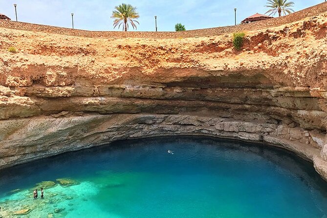 Full-Day Wadi Shab and Bimmah Sinkhole Tour - Cooling off at Bimmah Sinkhole