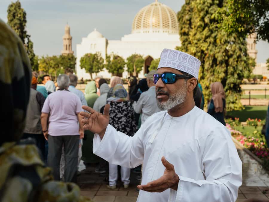 Guided Walking Tour of Sultan Qaboos Grand Mosque in Muscat - Marble courtyards and peaceful gardens