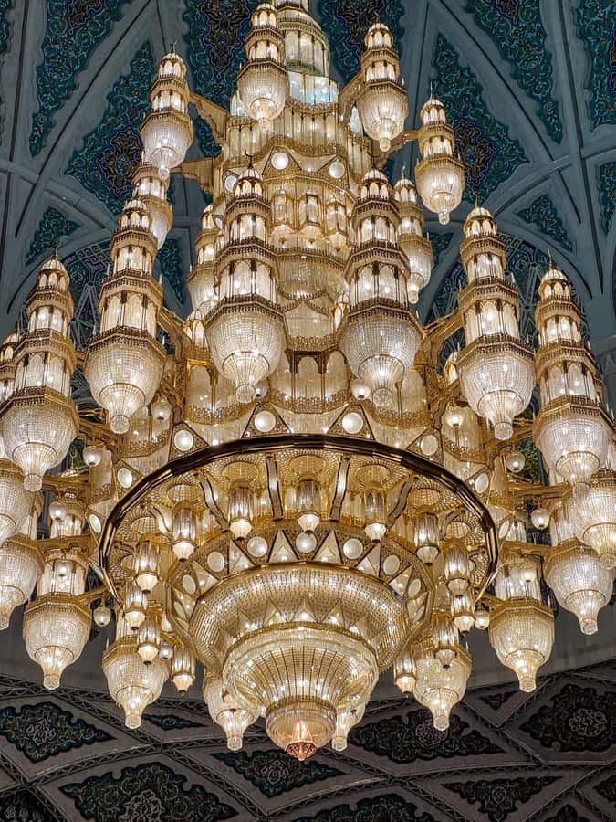 Guided Walking Tour of Sultan Qaboos Grand Mosque in Muscat - The entrance, minarets, and central dome