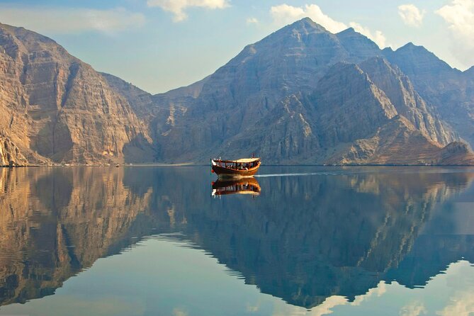 Khasab Full Day Dhow Cruise With Enjoying Snorkeling, Lunch & Dolphin Watching - Watching dolphins in the fjords
