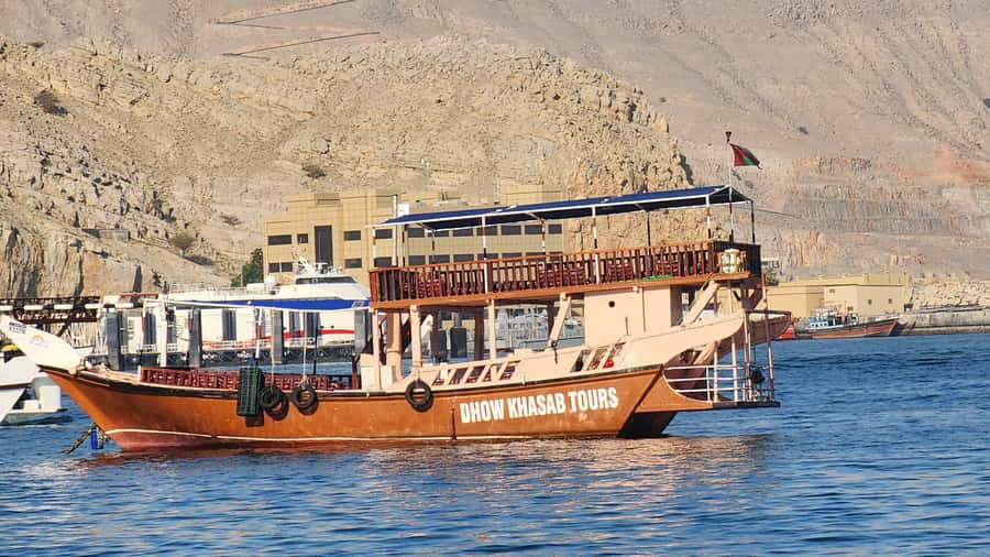 Khasab: Half-Day Dhow Cruise, Dolphin Watching, & Snorkeling - Leaving Khasab on a traditional dhow