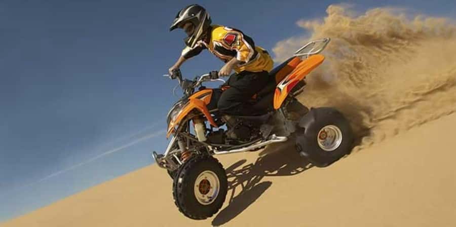 Muscat:Optional Quad Bike with Sunset Watching, Pickup&BBQ - Quad biking over the Bawshar dunes