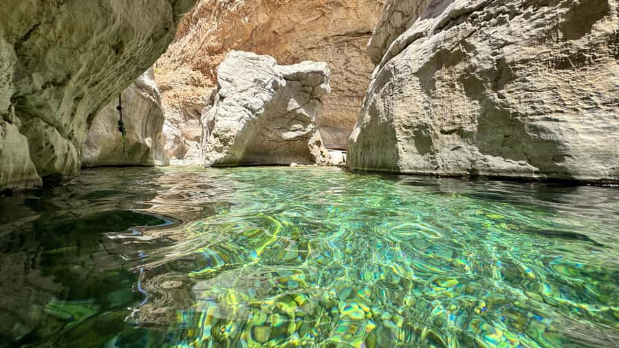 Muscat: Wahiba Desert and Wadi Bani Khalid Guided Group Tour - Wadi Bani Khalid: Clear Pools Beneath Palm Trees