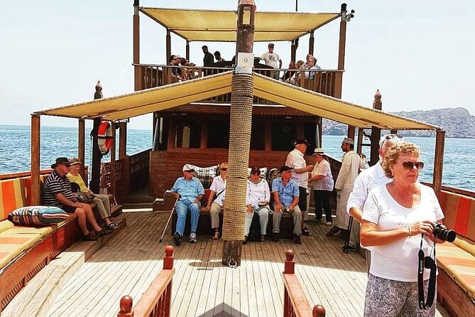 Omani Traditional Dhow Cruise: Sunset and Muscat Coastal View - Al Jalali Fort at harbor level