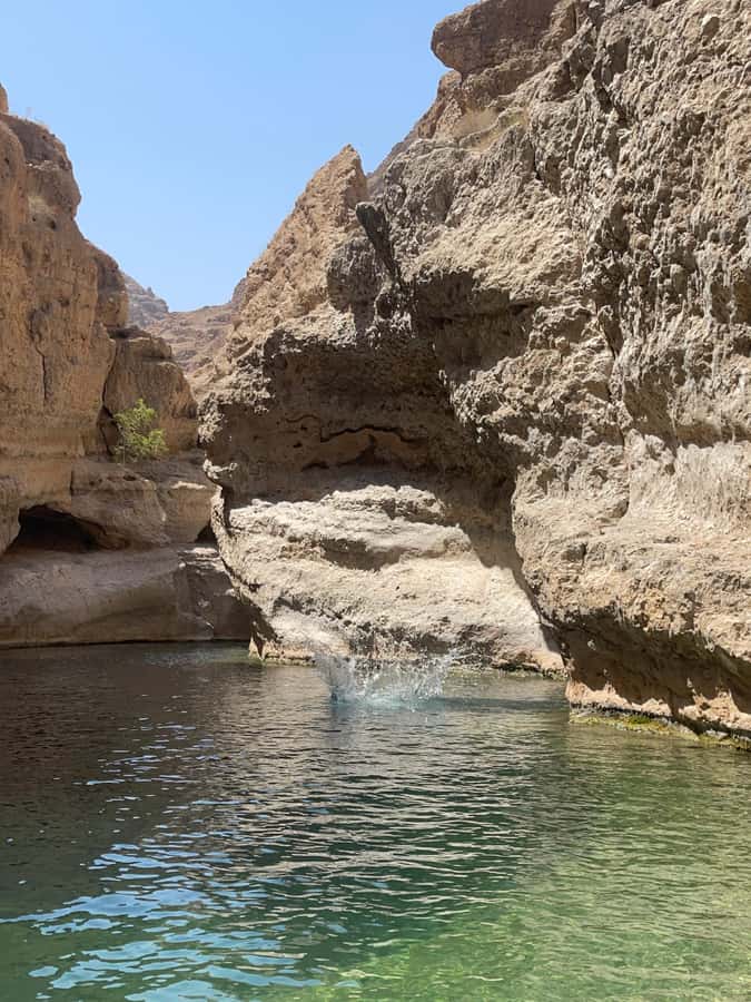 Wadi Shab Parking Meet the Local Guide for Self drivers - The 45-minute hike through the canyon